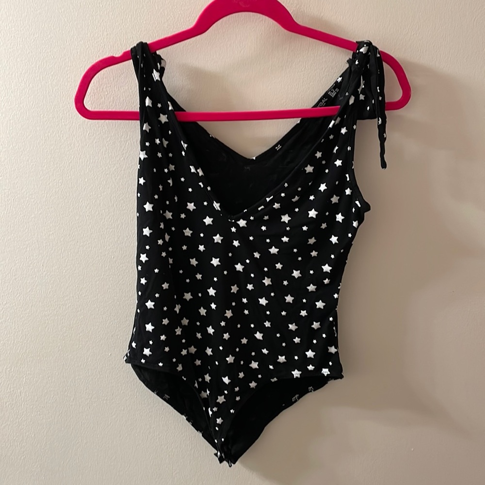 Nasty Gal black and white star body suit with adjustable straps